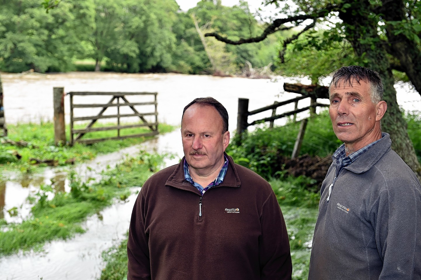 Jim Hope, left, and Gerald Stewart, right, beside the River Avon at The Dell Farm, Kirkmichael, Glenlivet, after the rescue. 