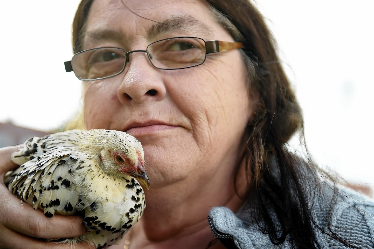 Moira Dent with one of her hens