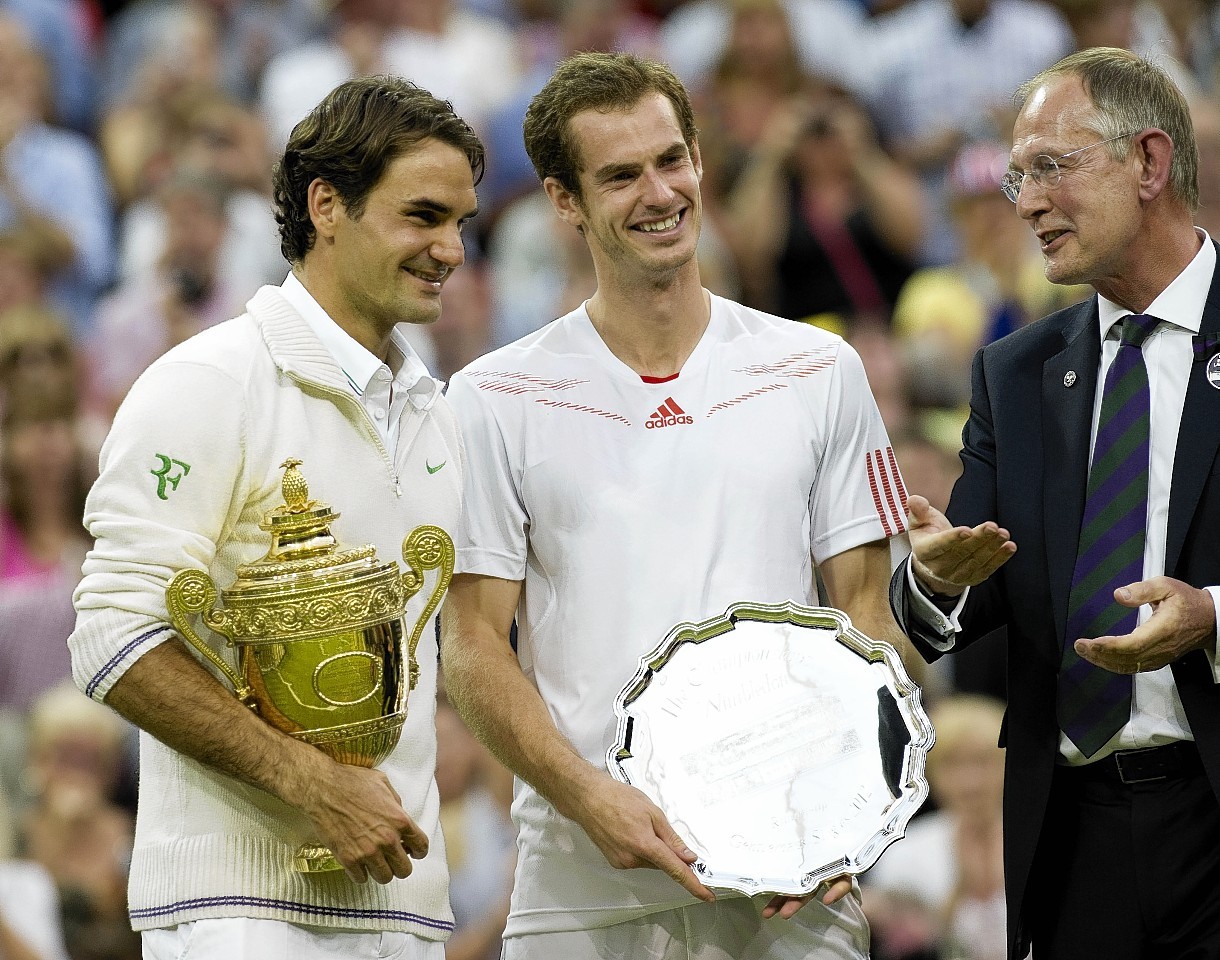 Murray puts on a brave face after he was beaten by Federer in the 2012 final