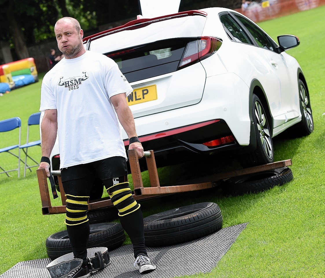 The Highland Strongman competition was held yesterday (Sun) in the Northern Meeting Park, Inverness. Iain Wood in action with the car lift.
