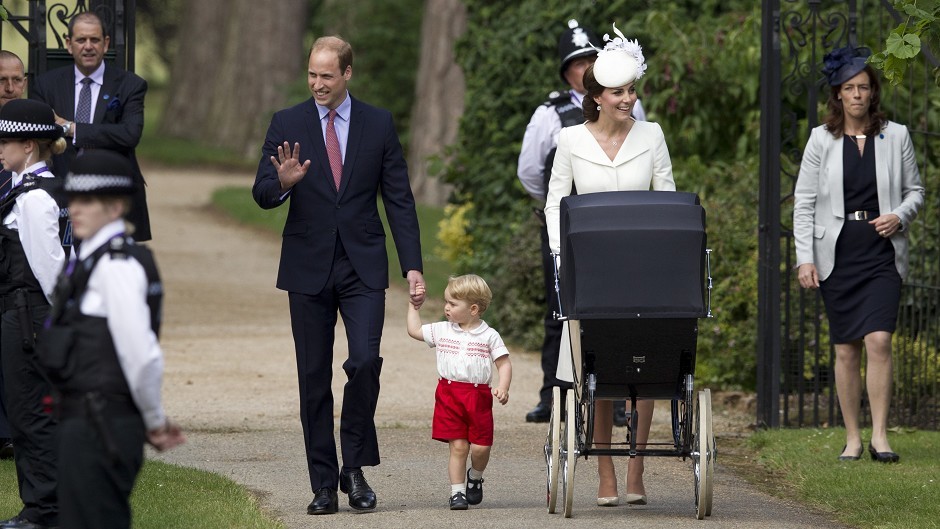 Prince William, Kate the Duchess of Cambridge, their son Prince George and daughter Princess Charlotte in a pram arrive for Charlotte's Christening. (AP)