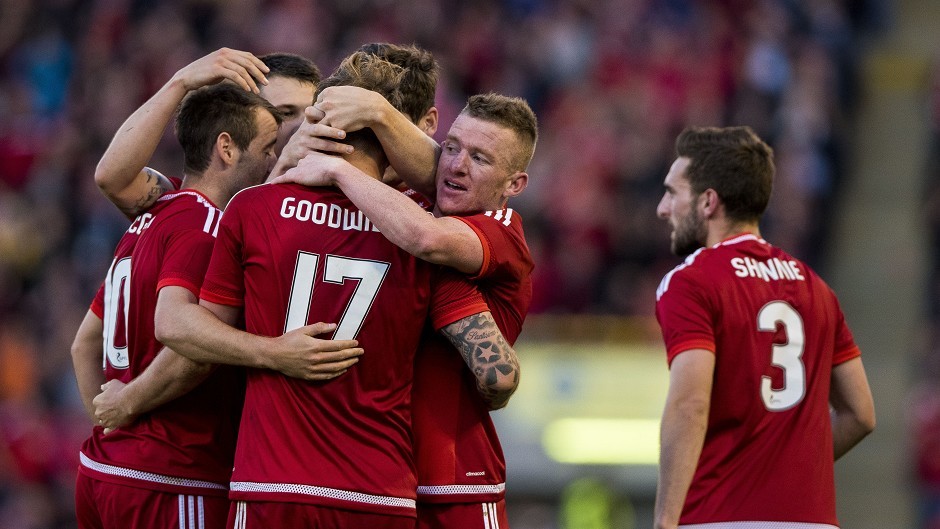 Aberdeen's Jonny Hayes is mobbed by team-mates after scoring the second goal against Rijeka