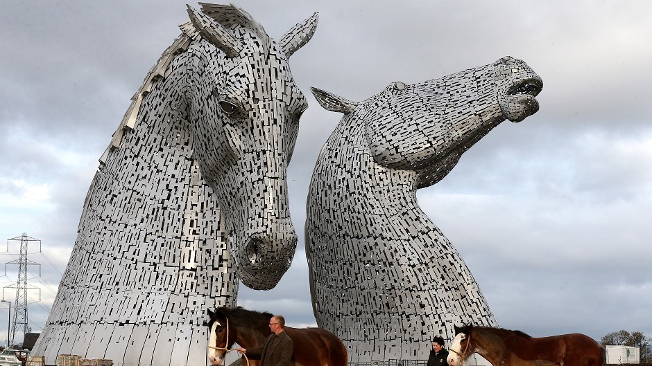 The scupltor of The Kelpies is threatening legal action over the presence of a burger bar close to his masterwork