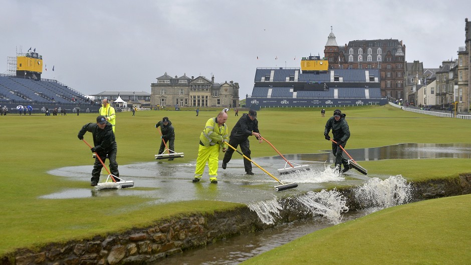 Groundstaff worked hard to clear the standing water