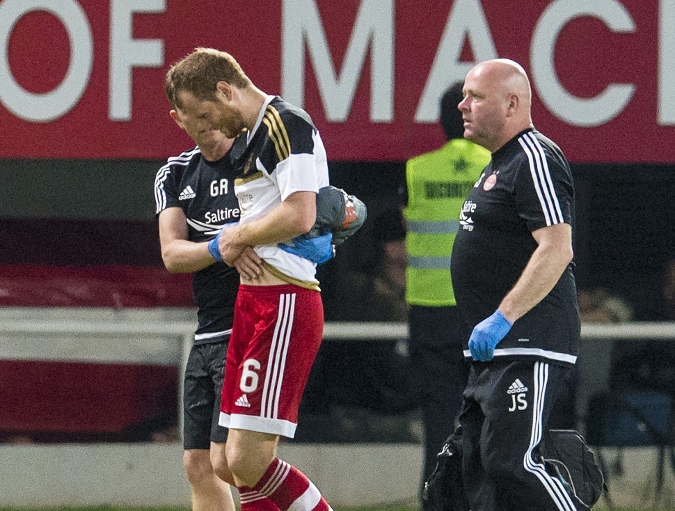 Reynolds leaves the pitch in Skopje after picking up the injury which is expected to keep him out until October