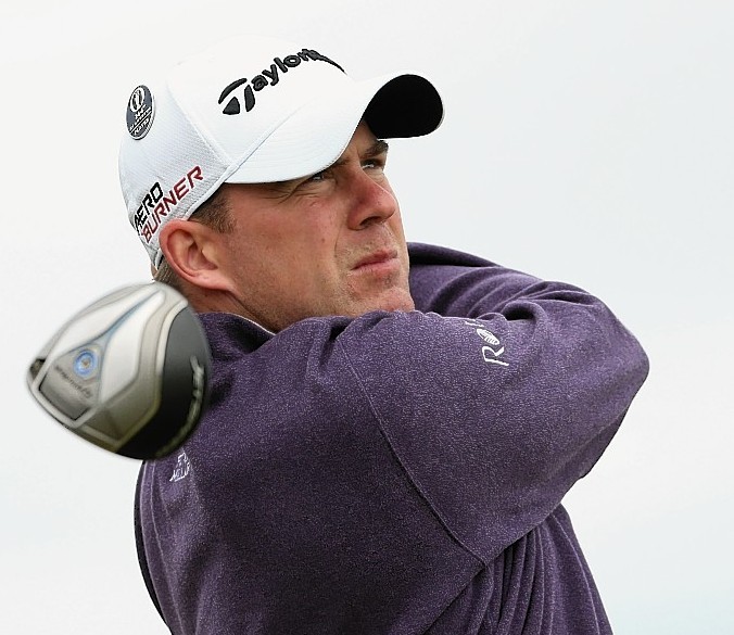 Richie Ramsay of Scotland tees off on 13 during a practice round ahead of the 144th Open Championship at The Old Course