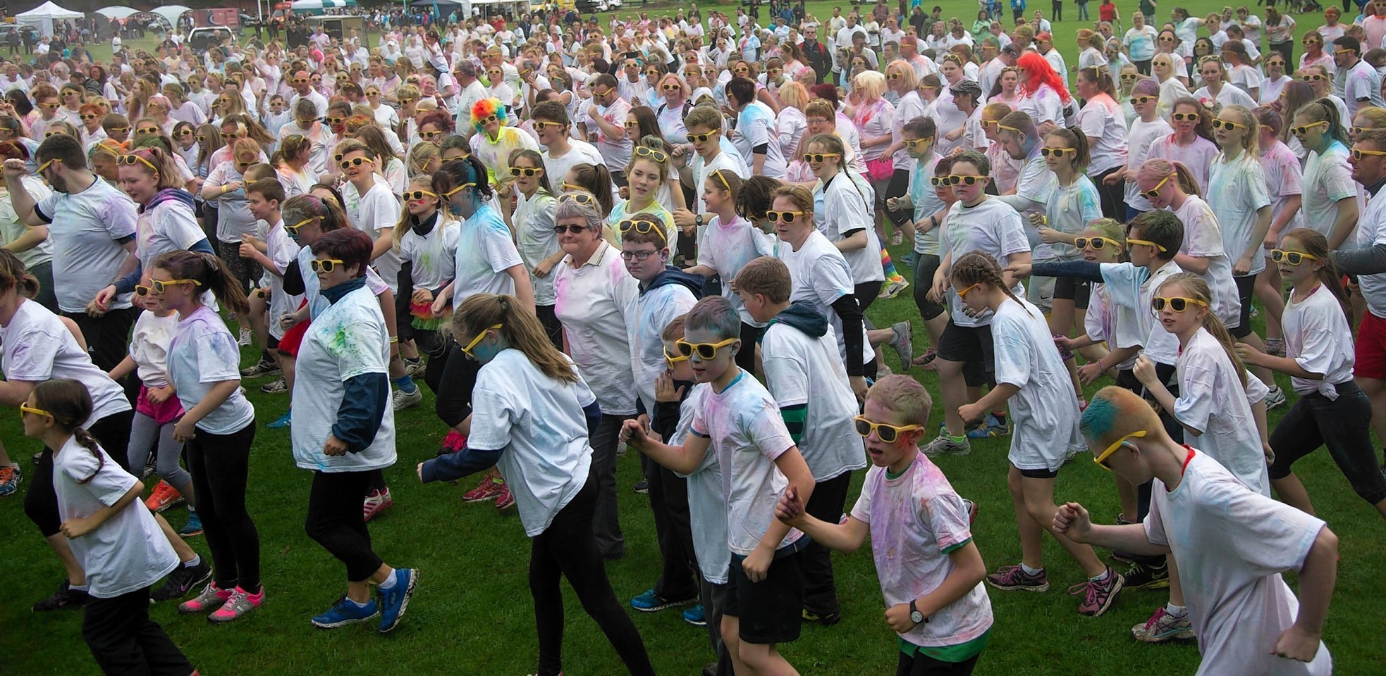 Runners take part in a charity event, Run For Colour in Inverness. 