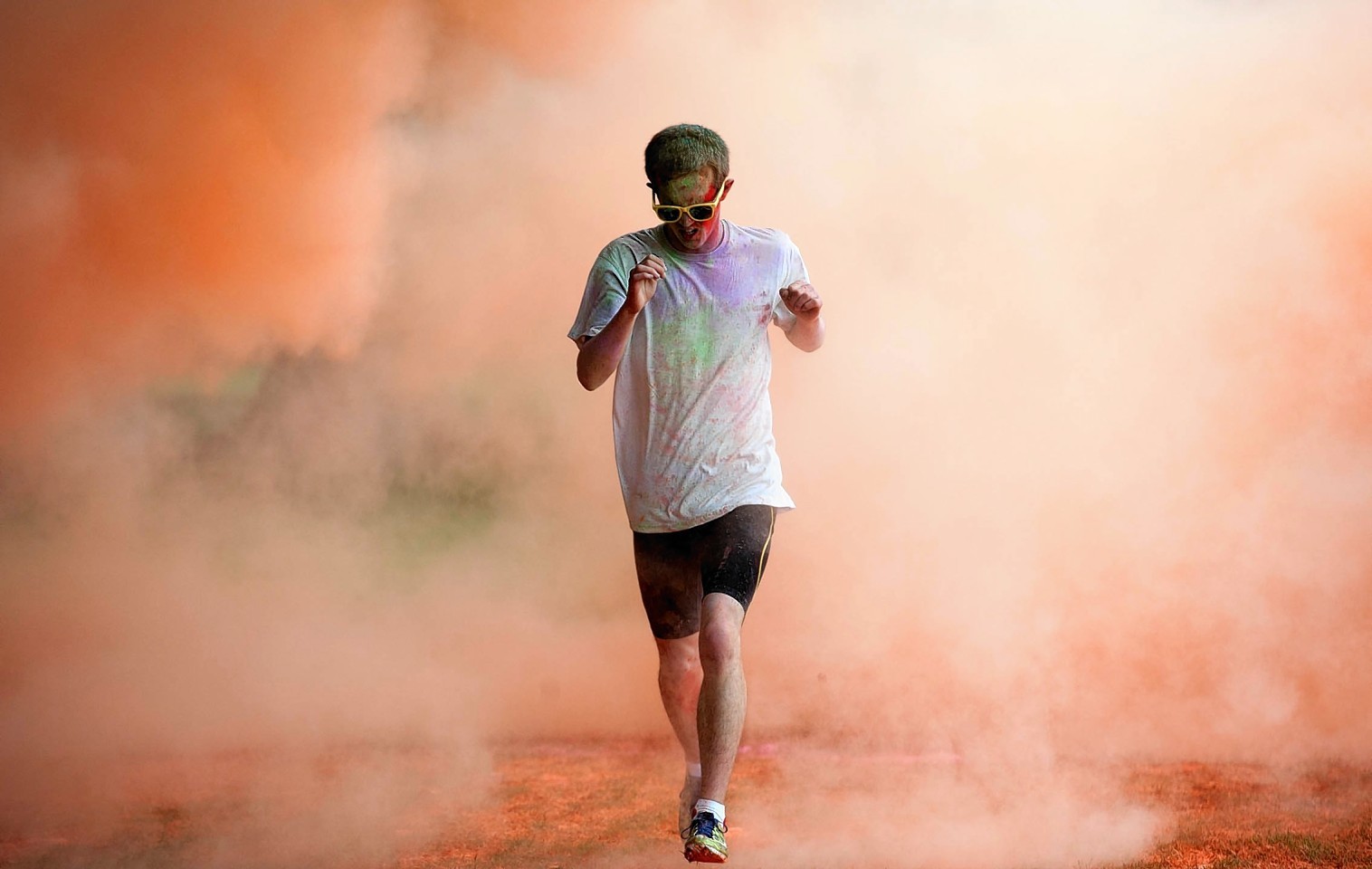 Runners take part in a charity event, Run For Colour in Inverness. 