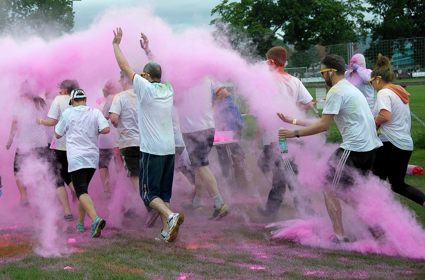 Runners take part in a charity event, Run For Colour in Inverness. 