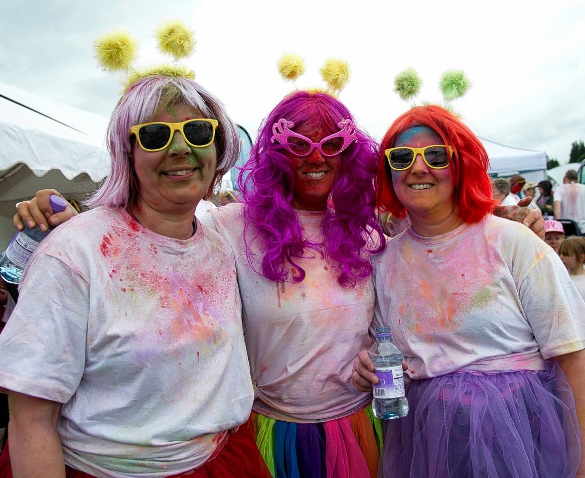 Runners take part in a charity event, Run For Colour in Inverness. 