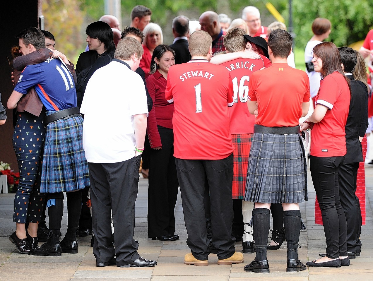 Mourners wore football shirts to Stewart McIntyre's funeral