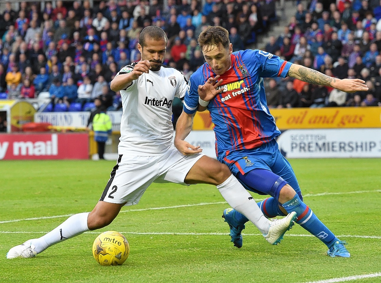 Tansey fights for the ball against Astra