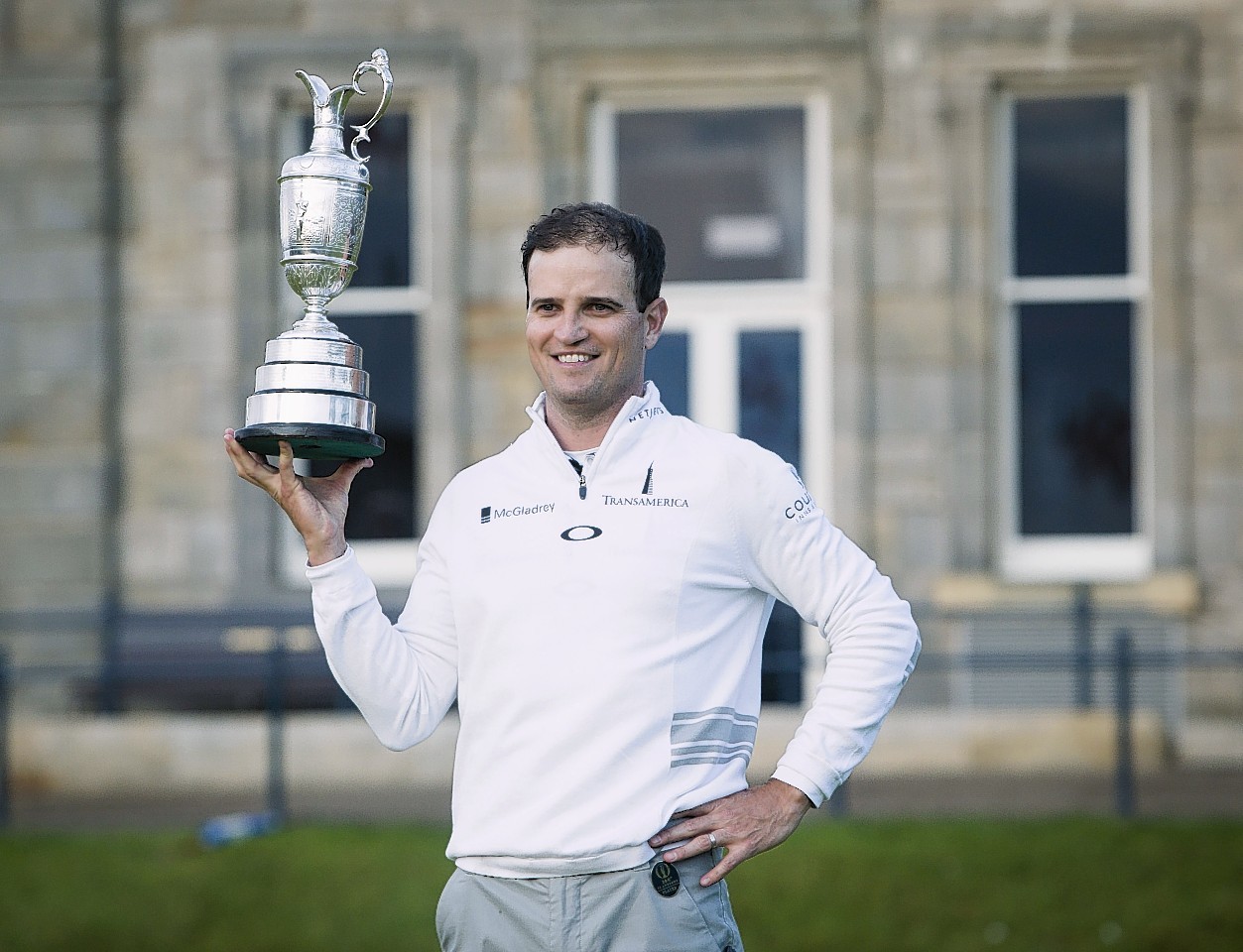 Johnson celebrates with the Claret Jug after winning The Open Championship 