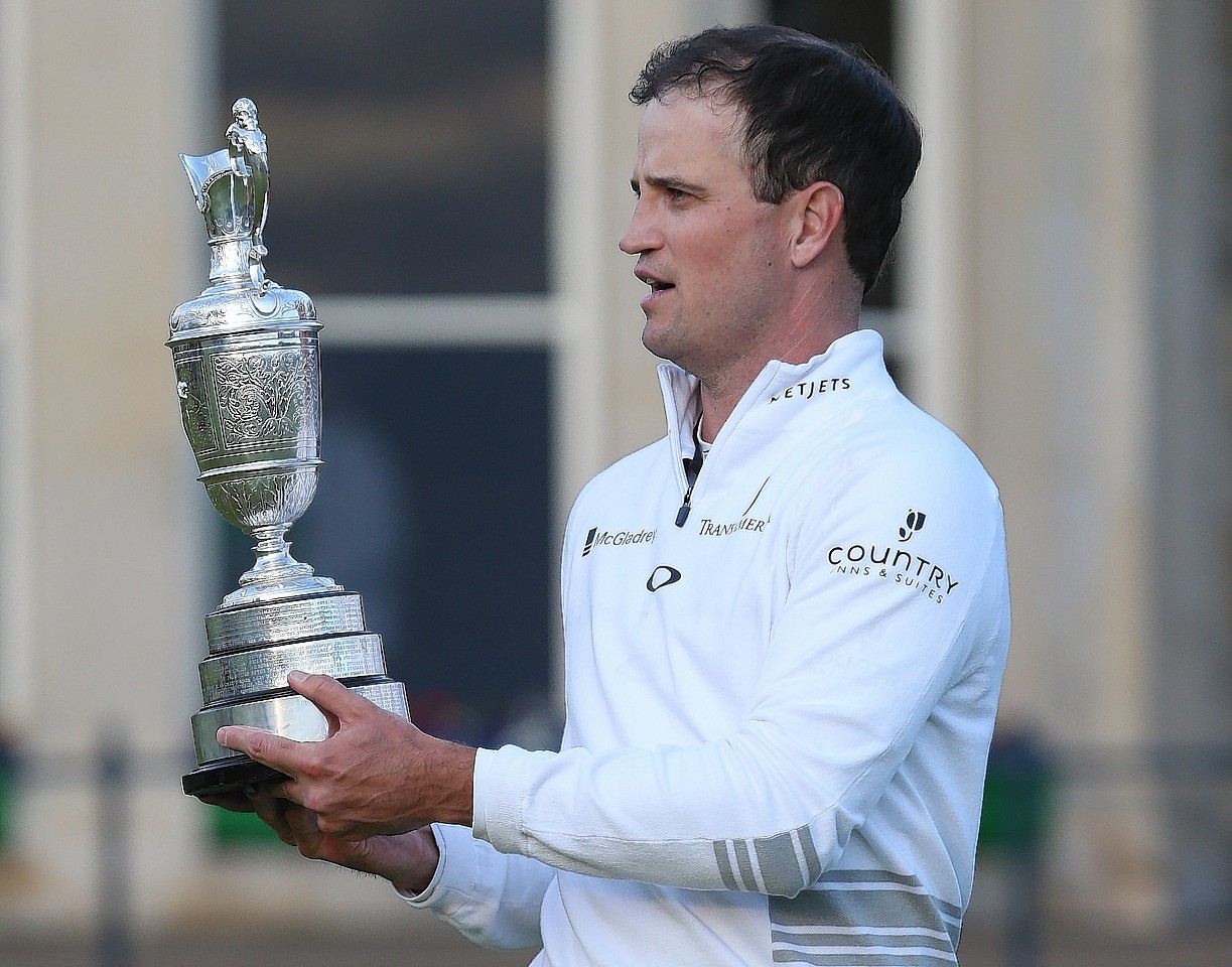 Johnson celebrates with the Claret Jug after winning The Open Championship. Picture by David Davies/PA Wire.