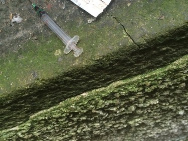 Dirty needles were found  on the pavement