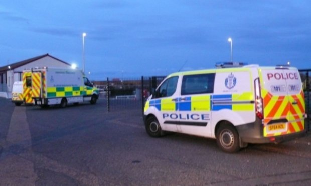 Police at the scene in Arbroath where the woman's body was found. Credit: The Courier