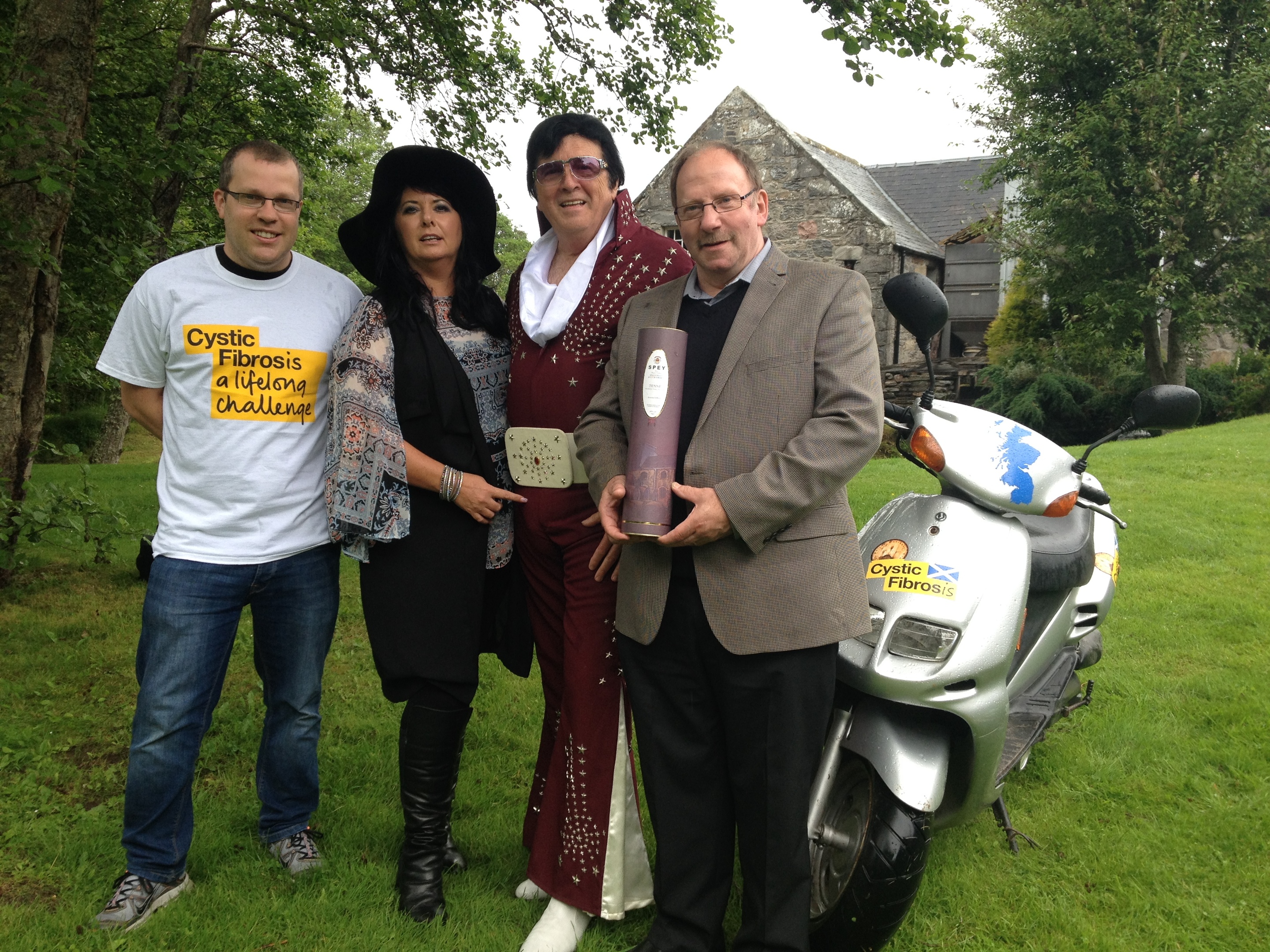 Mike Little, Patricia Dillon managing director, Elvis aka William Morin, and Sandy Jamieson, manager of Speyside Distillery.