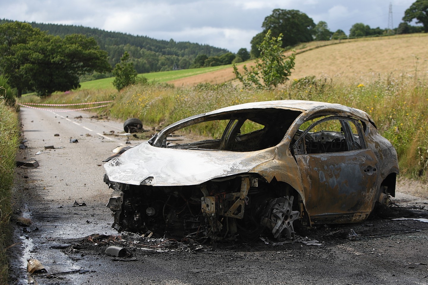 The remains of the burnt out car on the A831 near Kilmorack Gallery