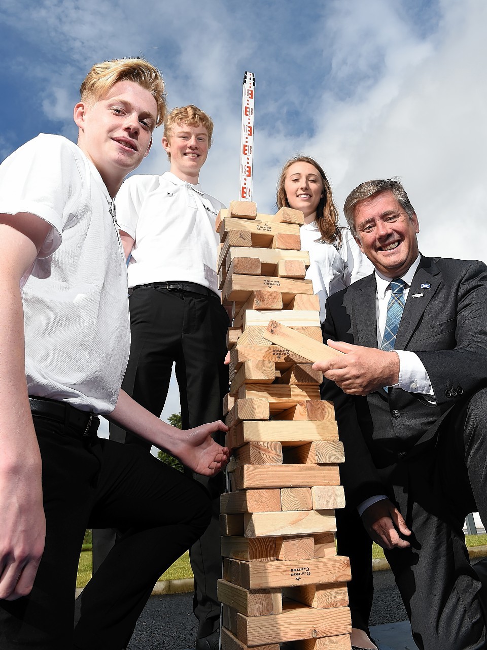Keith Brown, Infrastructure Minister with pupils from Kingussie High School.  (L-R) Sammy Denman, Scott Aisthorpe, Kirsty Adam and Minister Keith Brown.