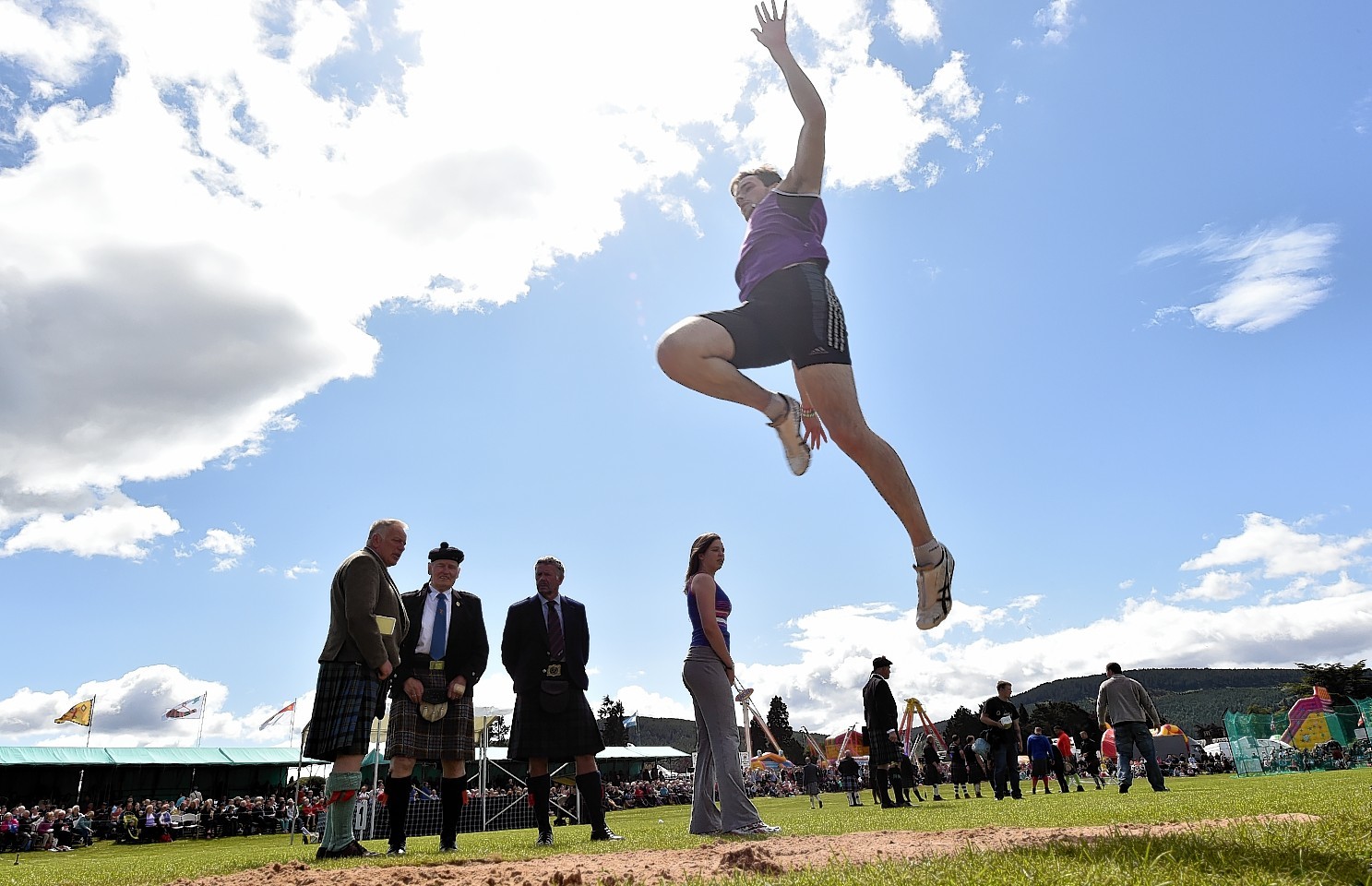 Aboyne Highland Games - The long jump Sam Lyon from Aberdeen.