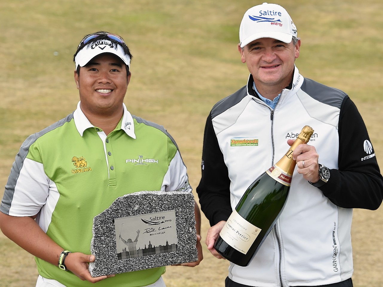 Saltire Energy Paul Lawrie Match Play winner Kiradech Aphibarnrat with host Paul Lawrie. Picture by Colin Rennie