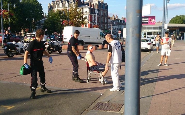 An injured man is wheeled away from Arras train station. Picture from @AdaSilvaArras