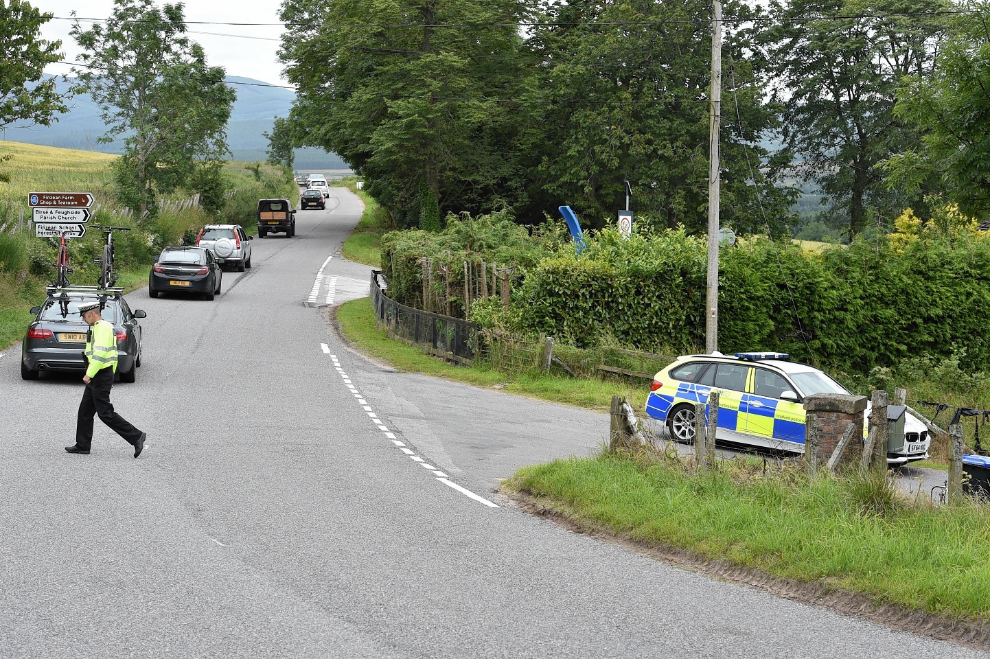 Police on the sceneof the crash on the B976