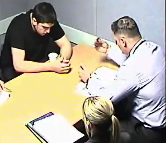 Handout picture from Scotland's Crown Office of Alexander Pacteau being questioned by detectives. 