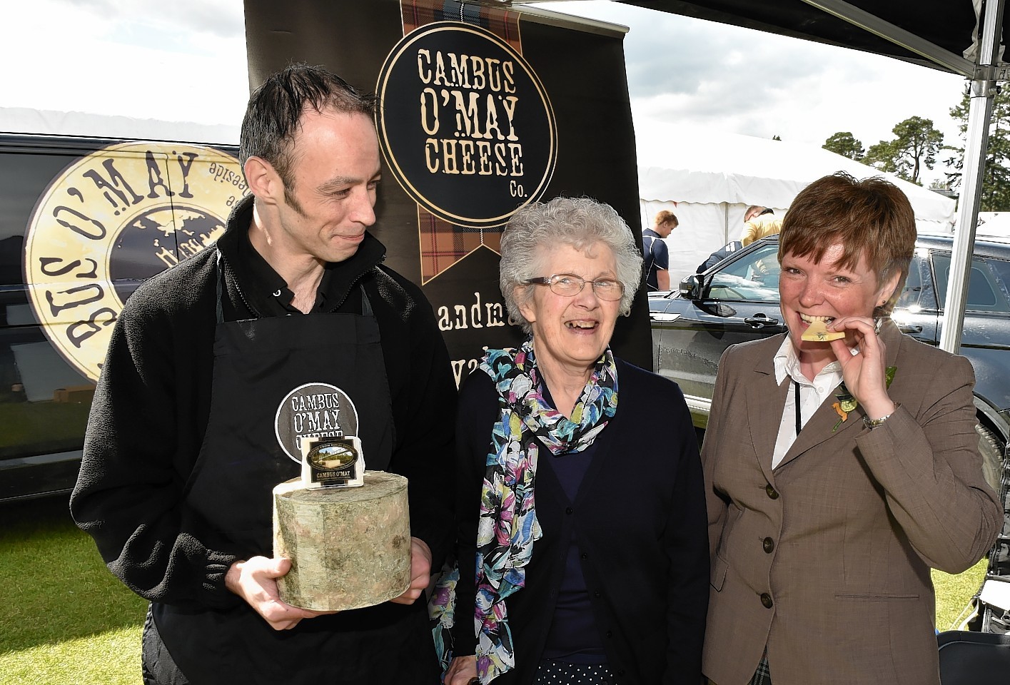 Aboyne secretary Morag McBeath (right) with cheesemaker James Reid and Barbara Reid. Picture by Colin Rennie