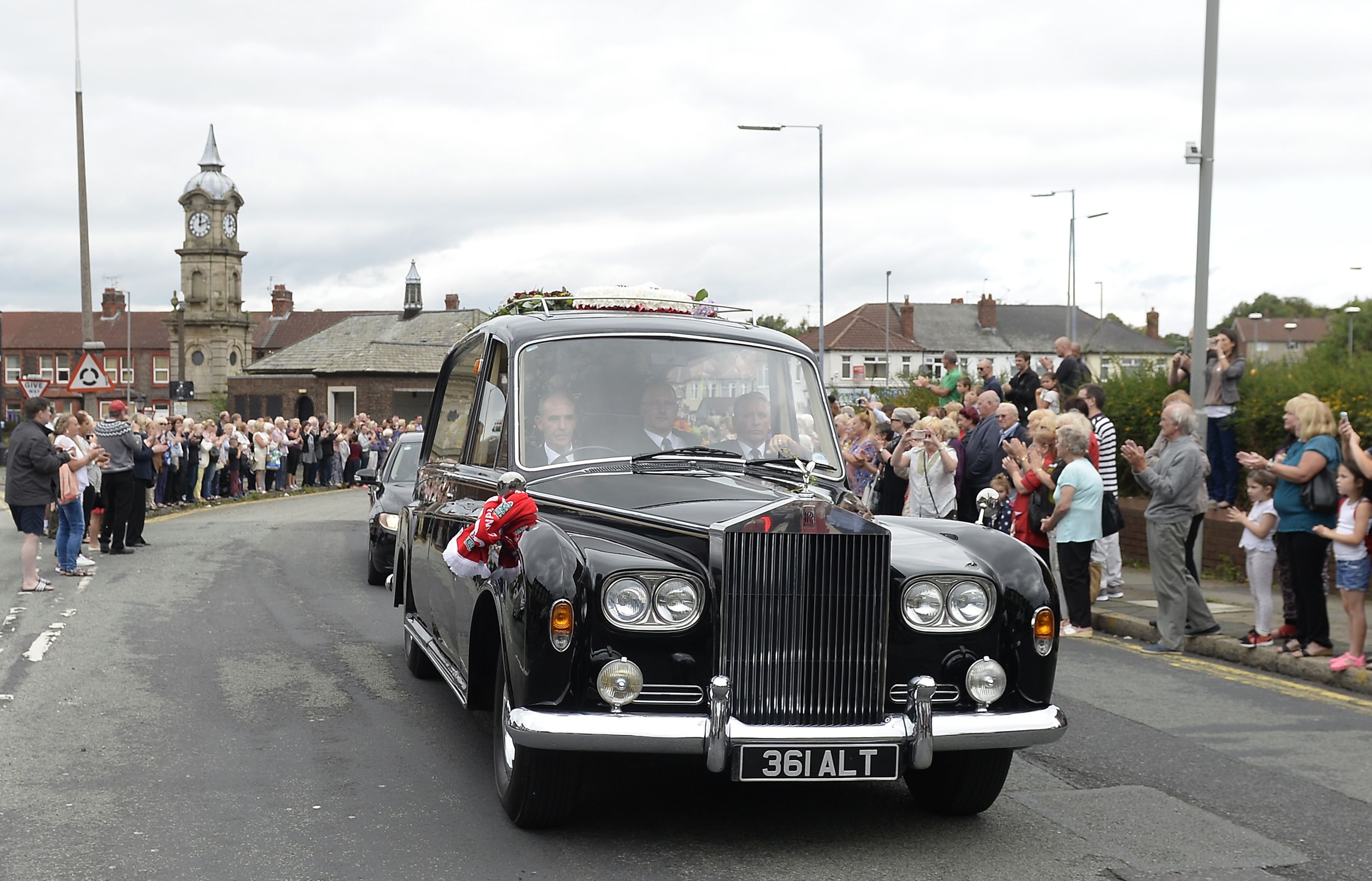 The coffin of Cilla Black makes its way along St Mary's Road to St Mary's Church in Woolton, Liverpool, for her funeral service.