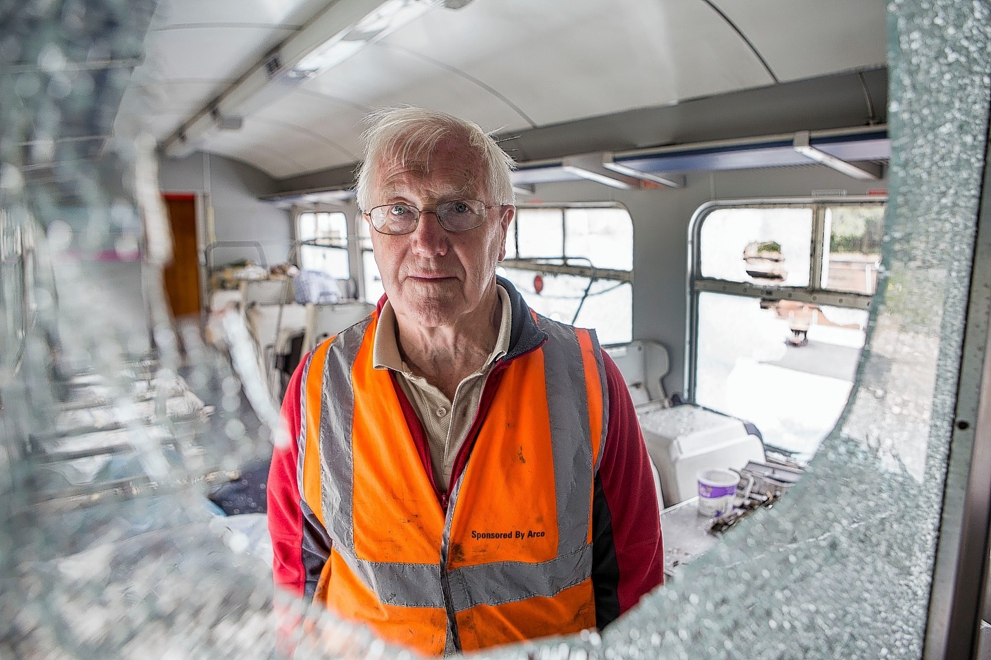 Bill Halliday inspecting the damage to the Royal Deeside carriage