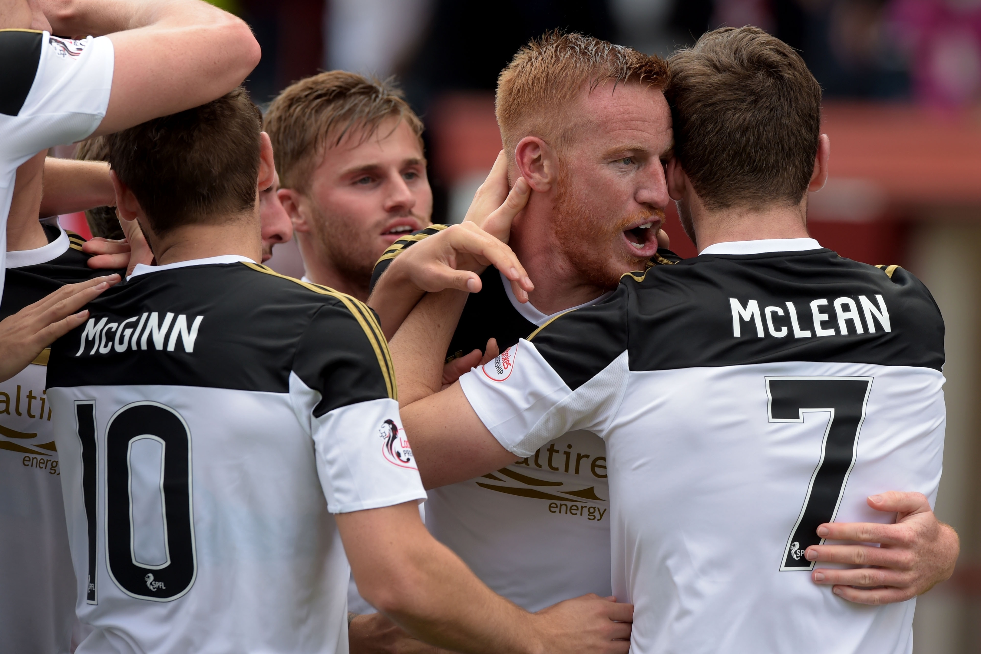 Adam Rooney celebrates his goal with Aberdeen team-mates Kenny McLean and David Goodwillie