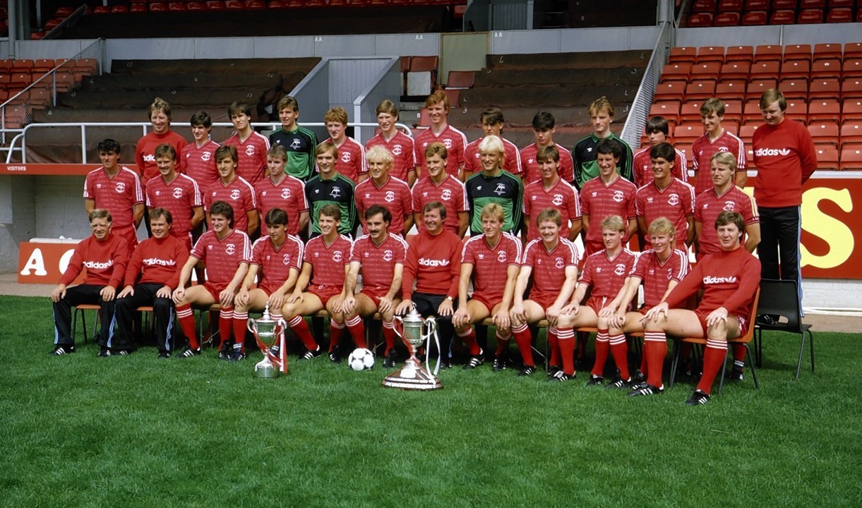 Teddy Scott with the team in 1984.