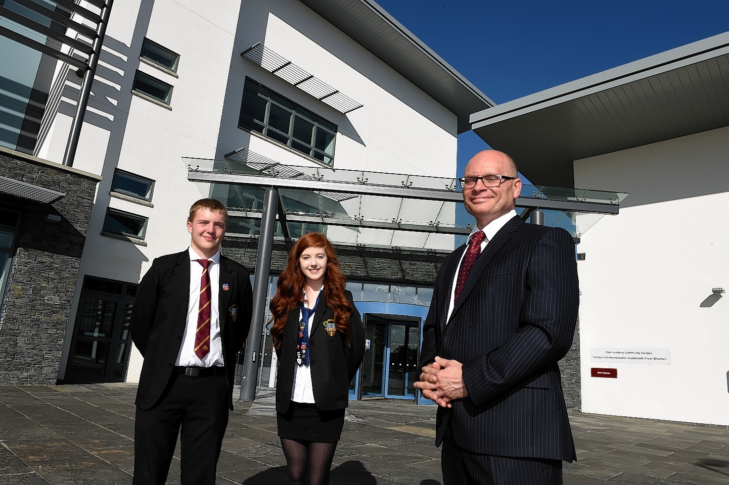 Head pupil's Max Poole and Jennifer Hendry with rector Tim McKay at the opening of the £36million Ellon Academy Community Campus at Cromleybank.  Picture by KEVIN EMSLIE