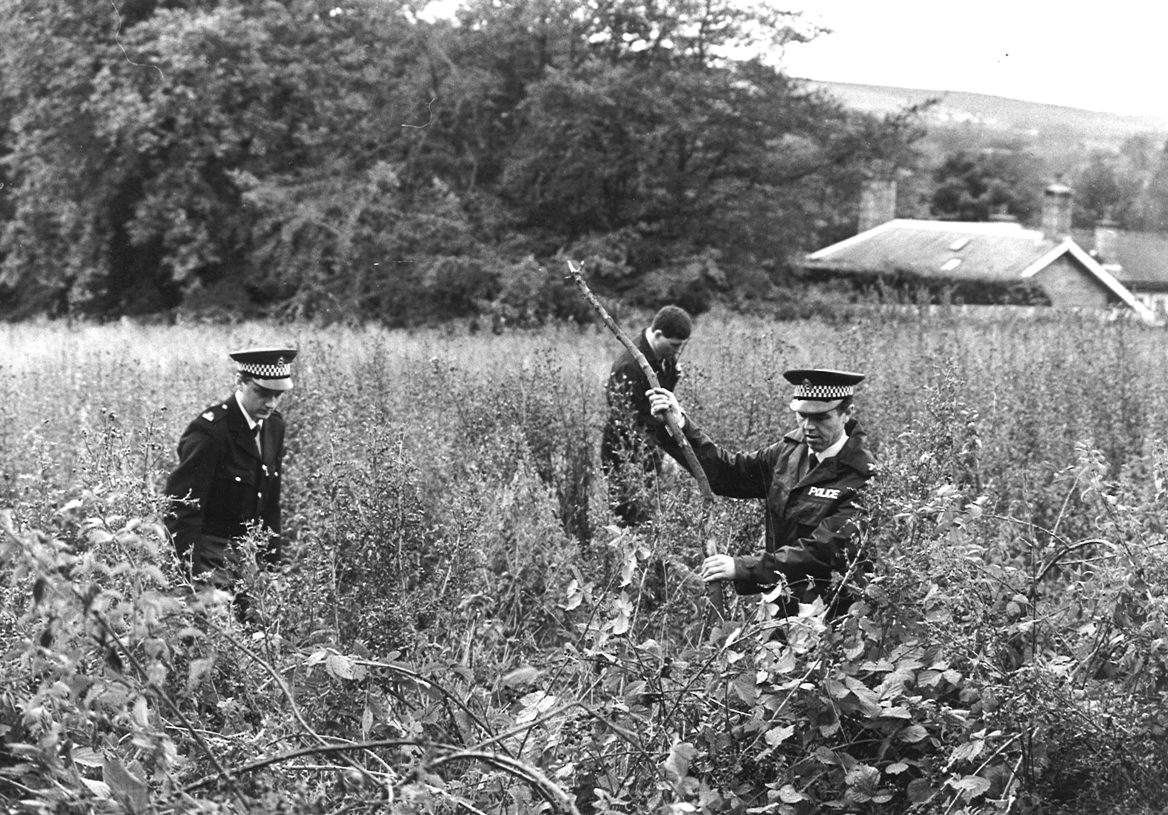 Police search thick undergrowth at Station Road, Pitfodels