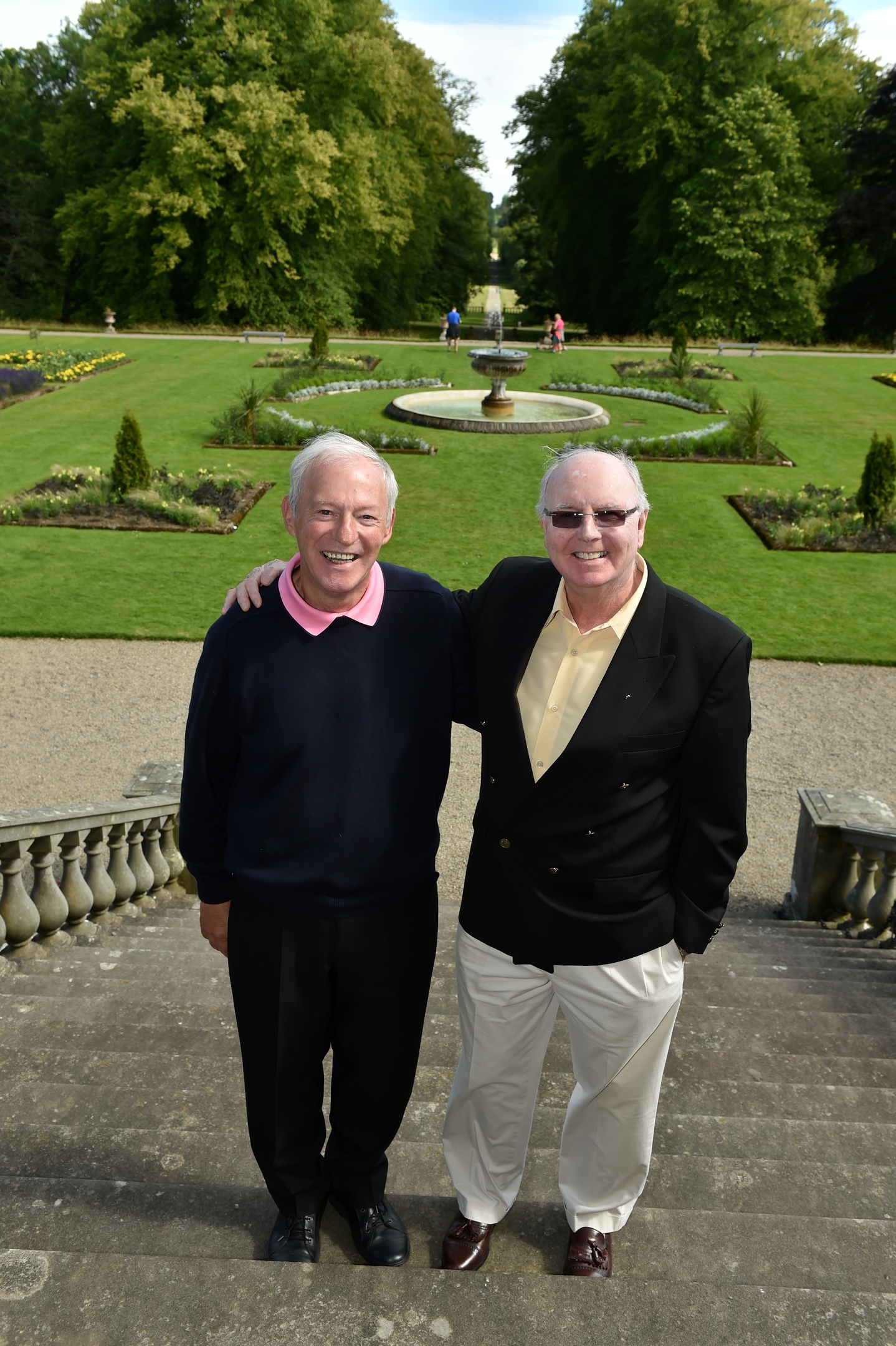 Haddo House - The war babies - 'babies' and parents on the steps of Haddo House. Jim Alexander (left) and John McVey meet up again. They were born one month apart at Haddo in 1944. Jim Alexander can be contacted on 01261 861771. Picture by COLIN RENNIE   August 9, 2015.