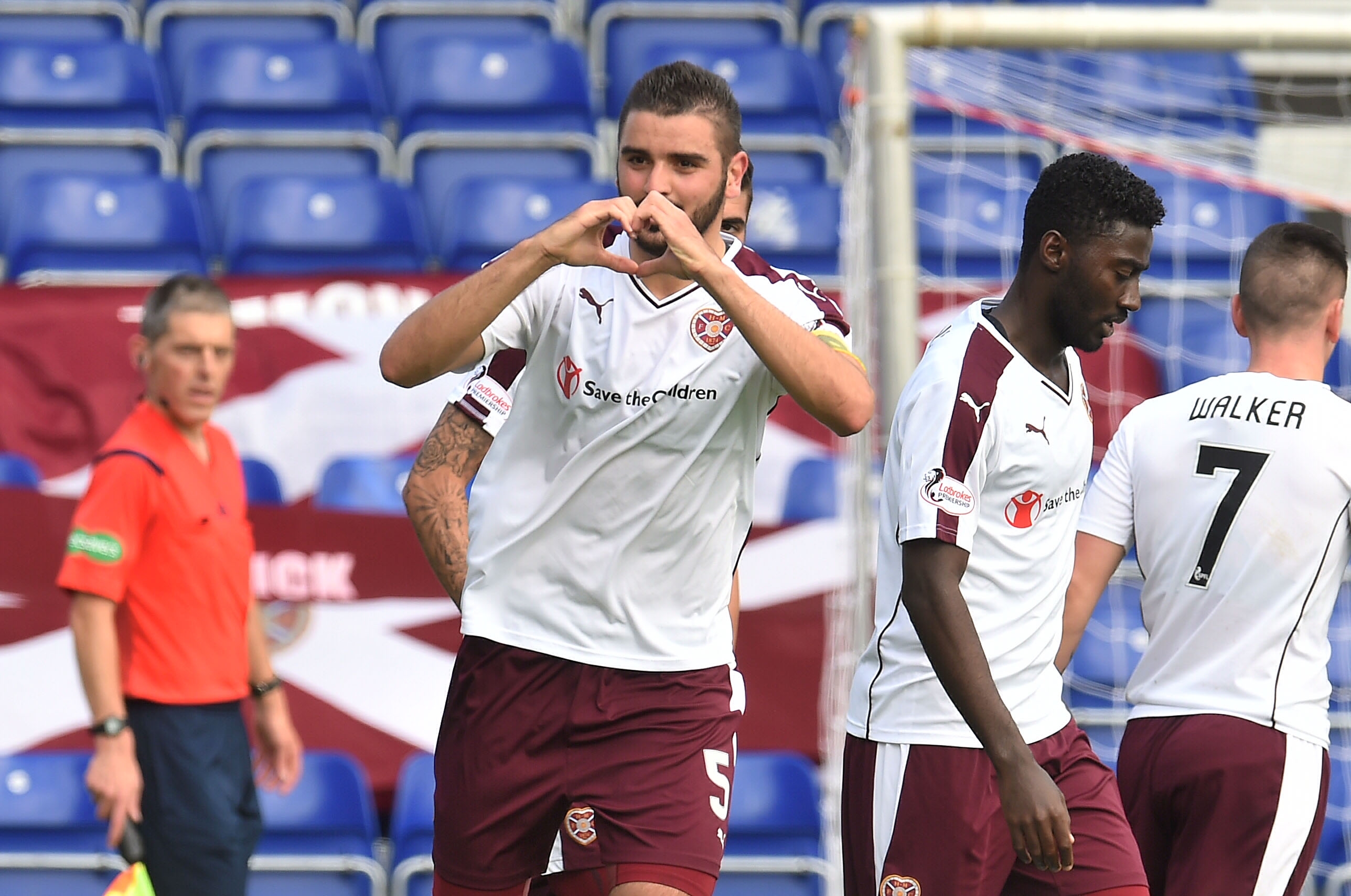 Alim Ozturk celebrates after scoring to give Hearts a two-goal lead