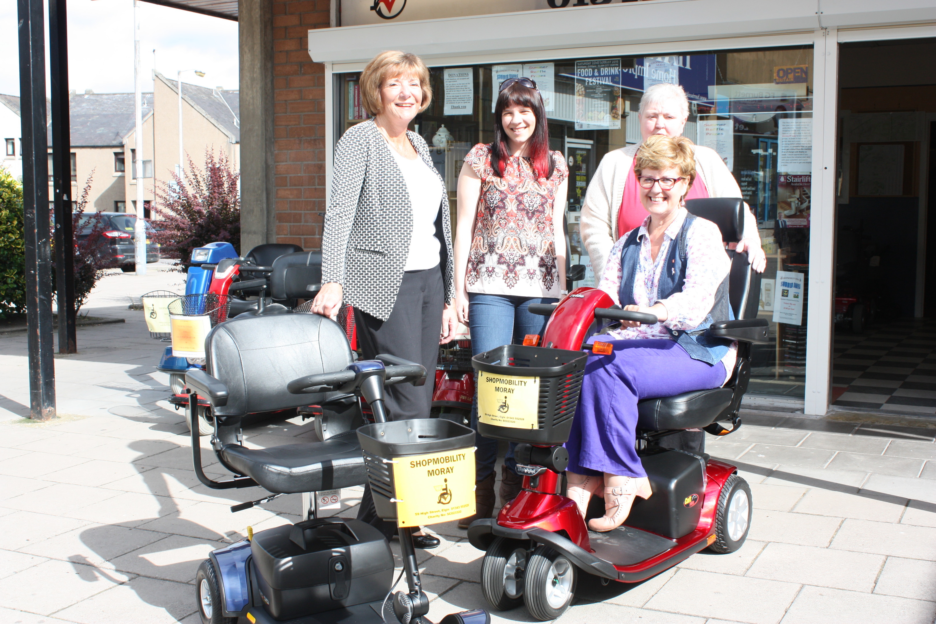 Volunteers from Shopmobility Moray, with Gordon and Ena Baxter Foundation's Kay Jackson