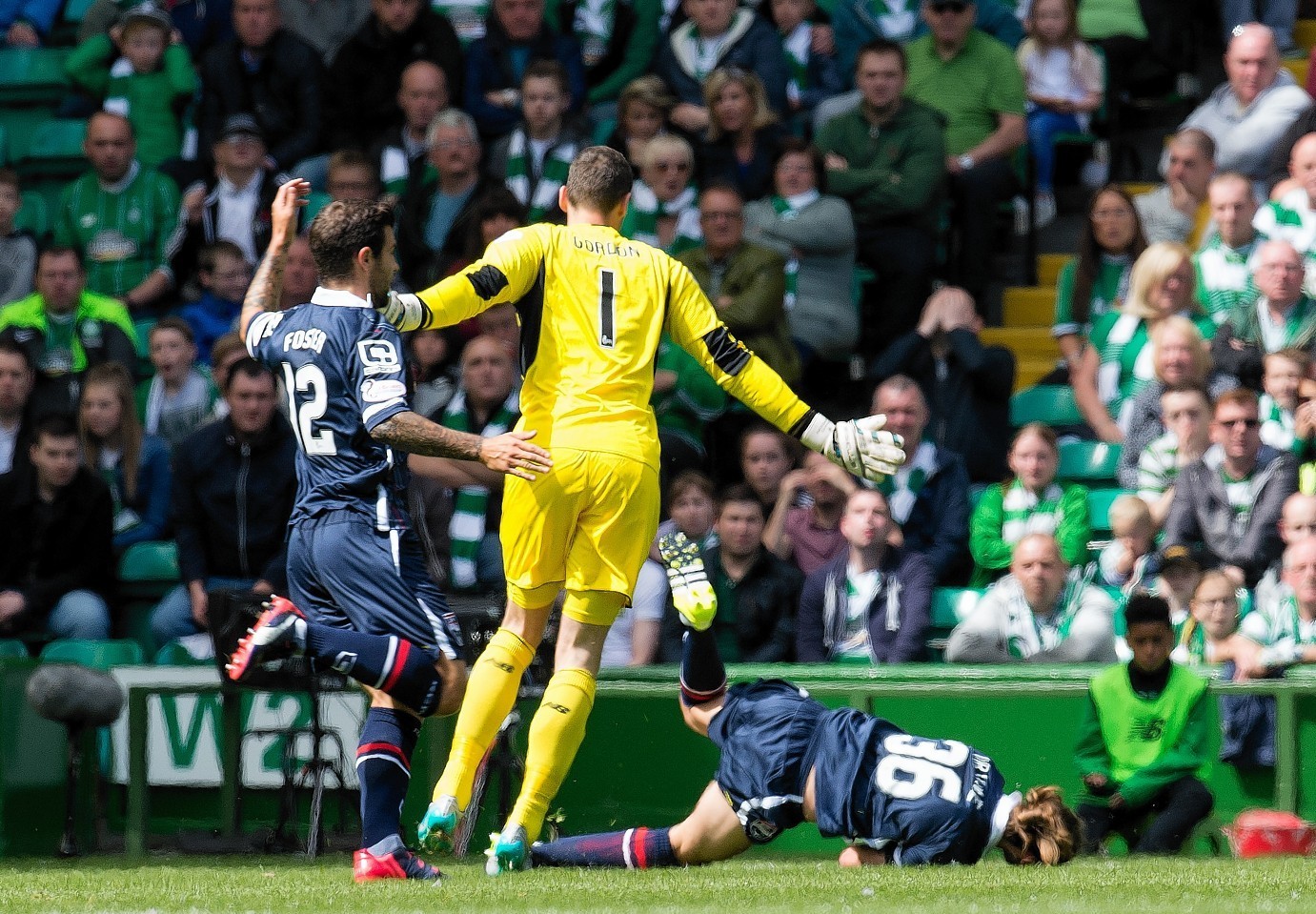 Jackson Irvine is floored by Celtic keeper Craig Gordon