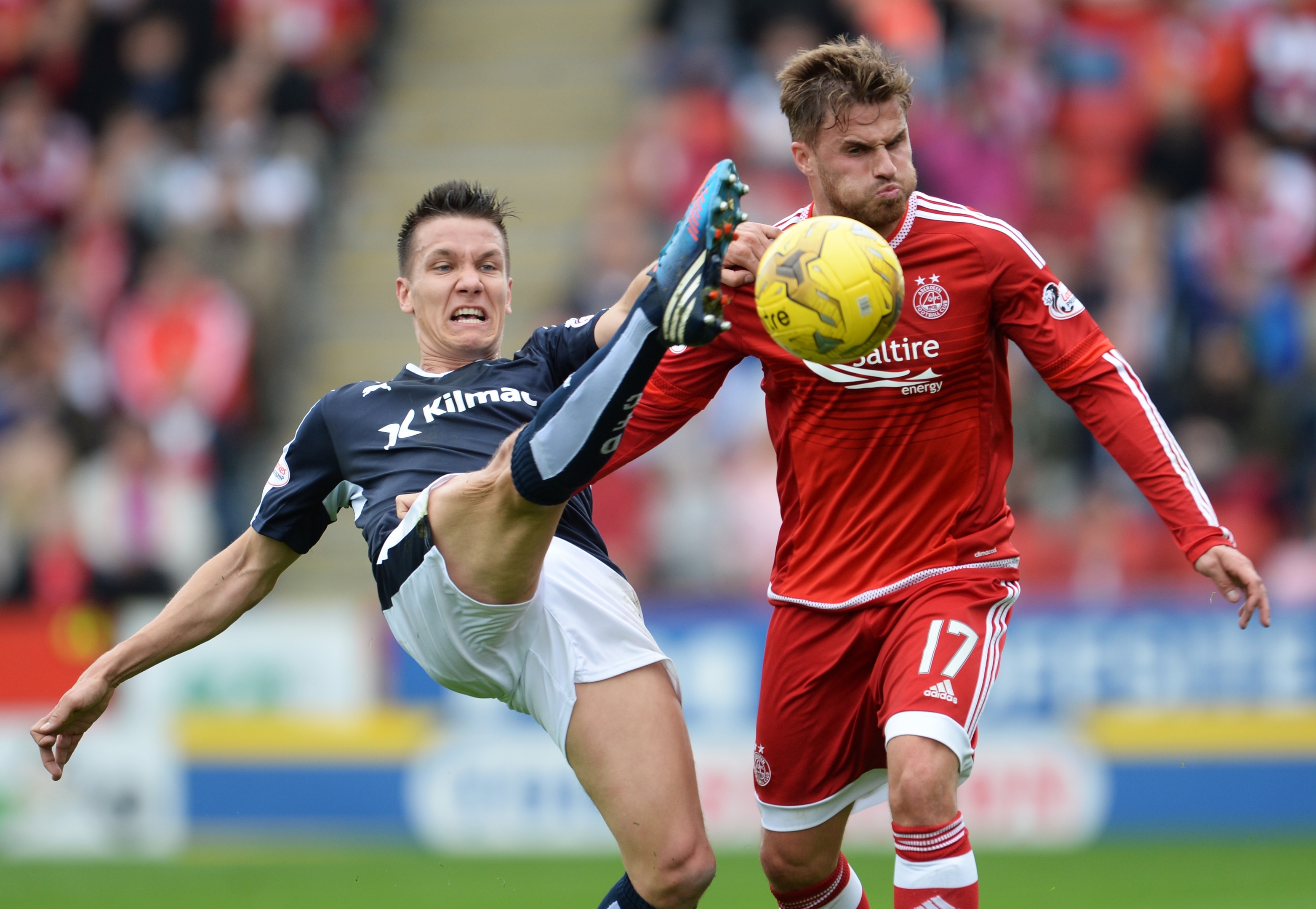 Dundee's Thomas Konrad battles with David Goodwillie