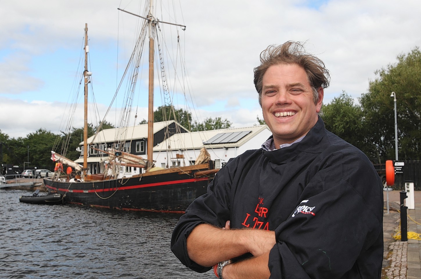 Skipper Ben Swain with the historic ship, Leader, in Inverness