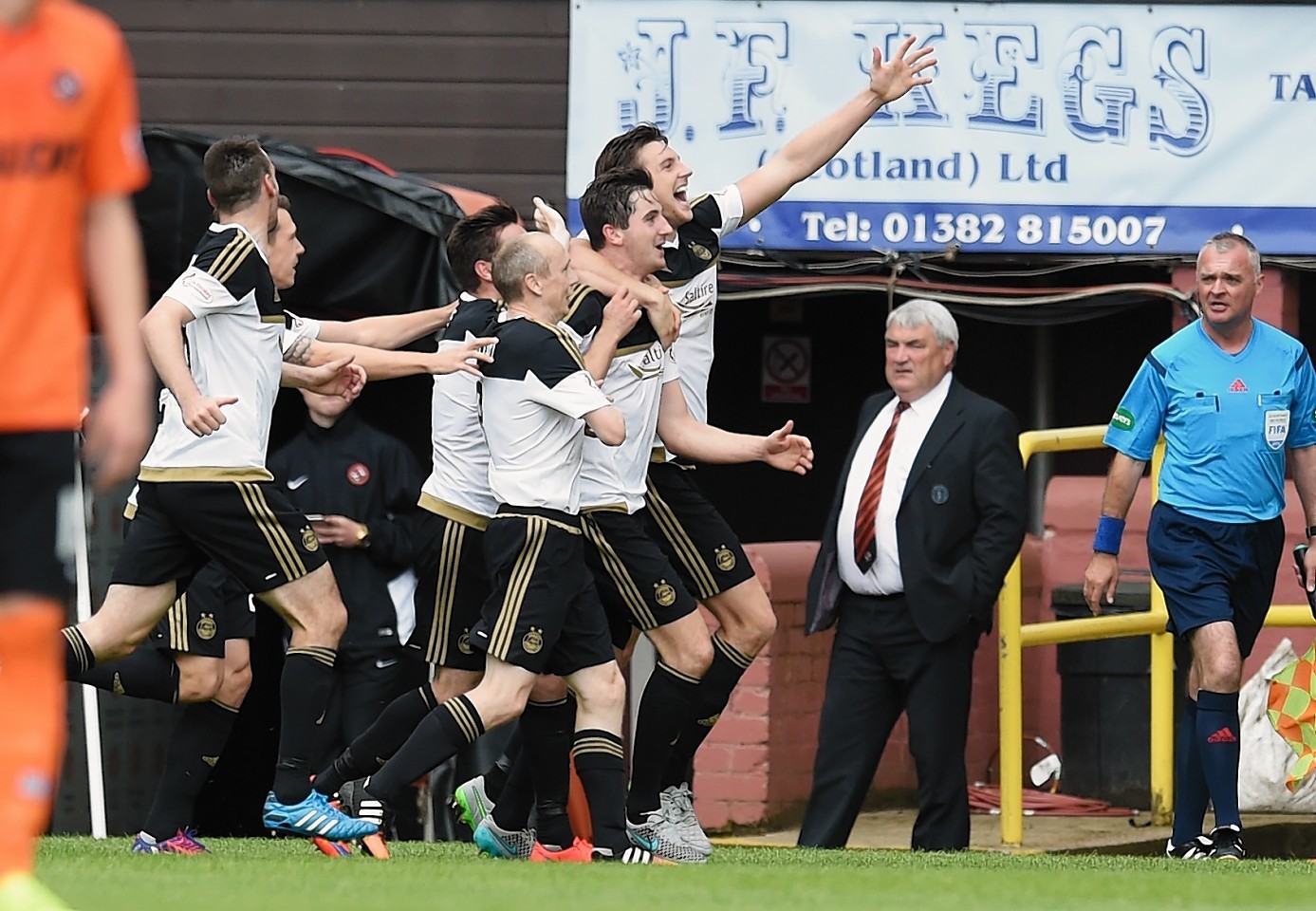 Flood joins in the celebrations following McLeans goal