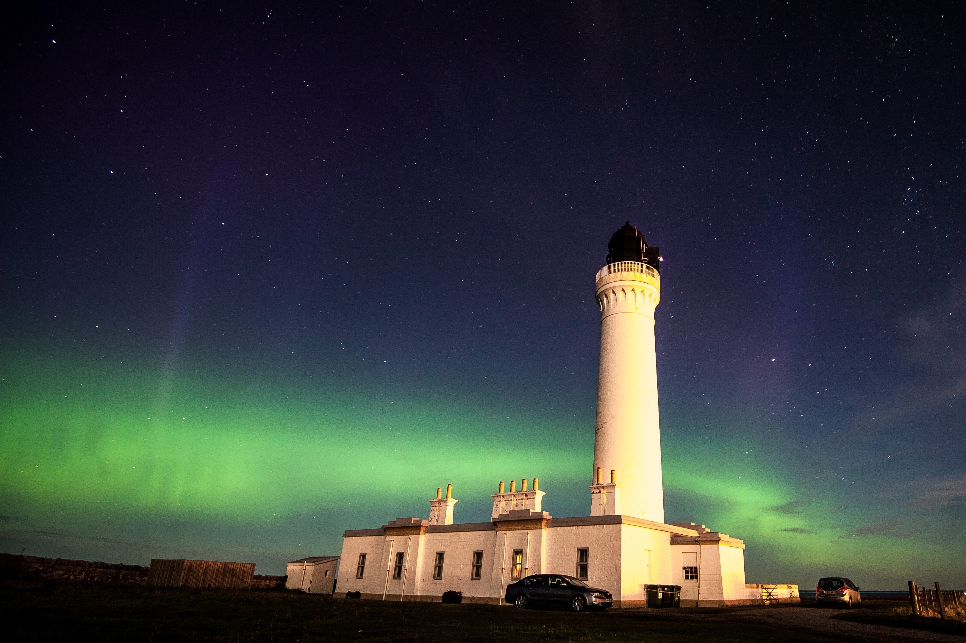 The Northern Lights, Aurora Borealis, are seen over the lighthouse in Lossiemouth, Scotland