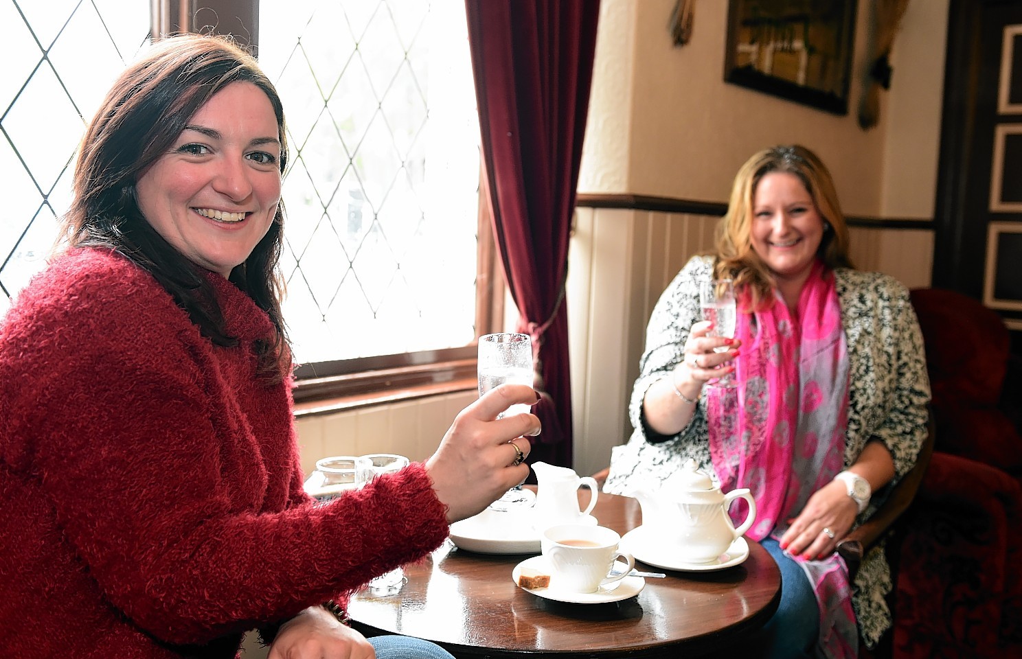 Old regular customers Grace Cranna (left) and Jenny Strachan at the inn on it's first day back open.       Picture by Kami Thomson 