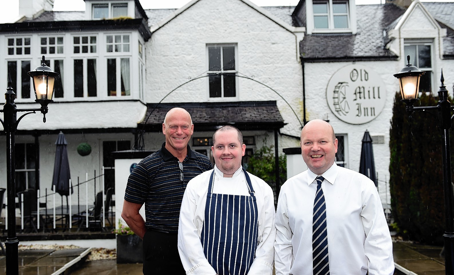 The Old Mill Inn, Maryculter, has reopened after almost a year.    
Pictured - Owners Vic Sang (left) and Mike French (right) with head chef Darren McKay (middle) at the inn on it's first day back open.   Picture by Kami Thomson