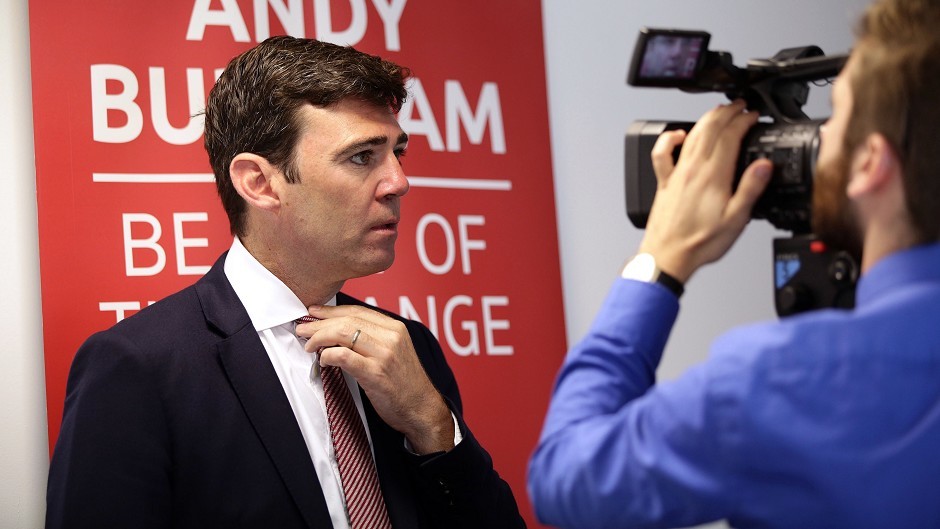 Labour leadership candidate Andy Burnham adjusts his tie