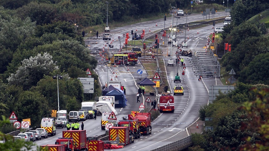 Emergency services on the A27 at Shoreham in West Sussex where the historic Hawker Hunter fighter jet plummeted onto the major south coast road