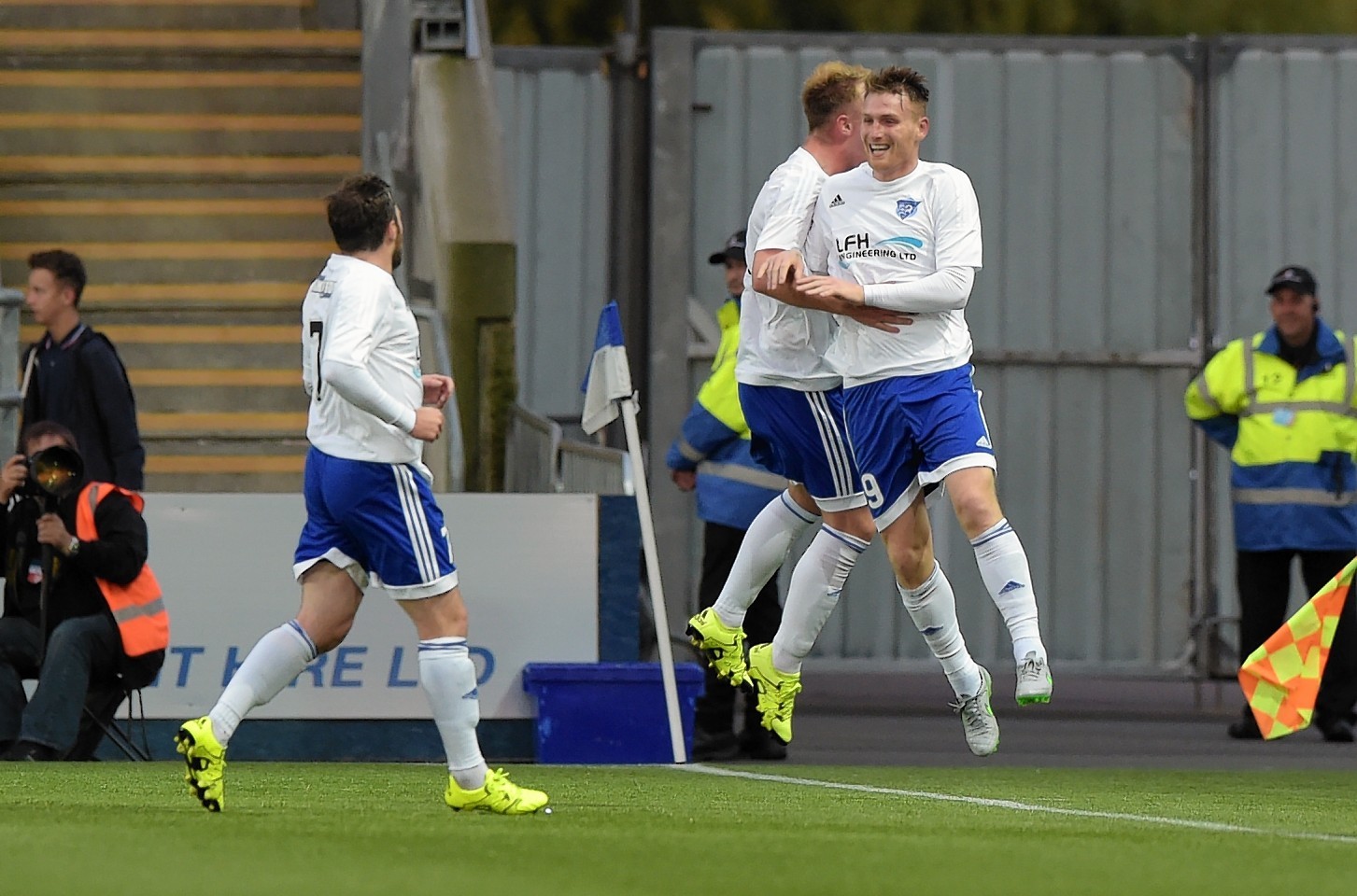 McAllister (right) celebrates after grabbing his hat-trick