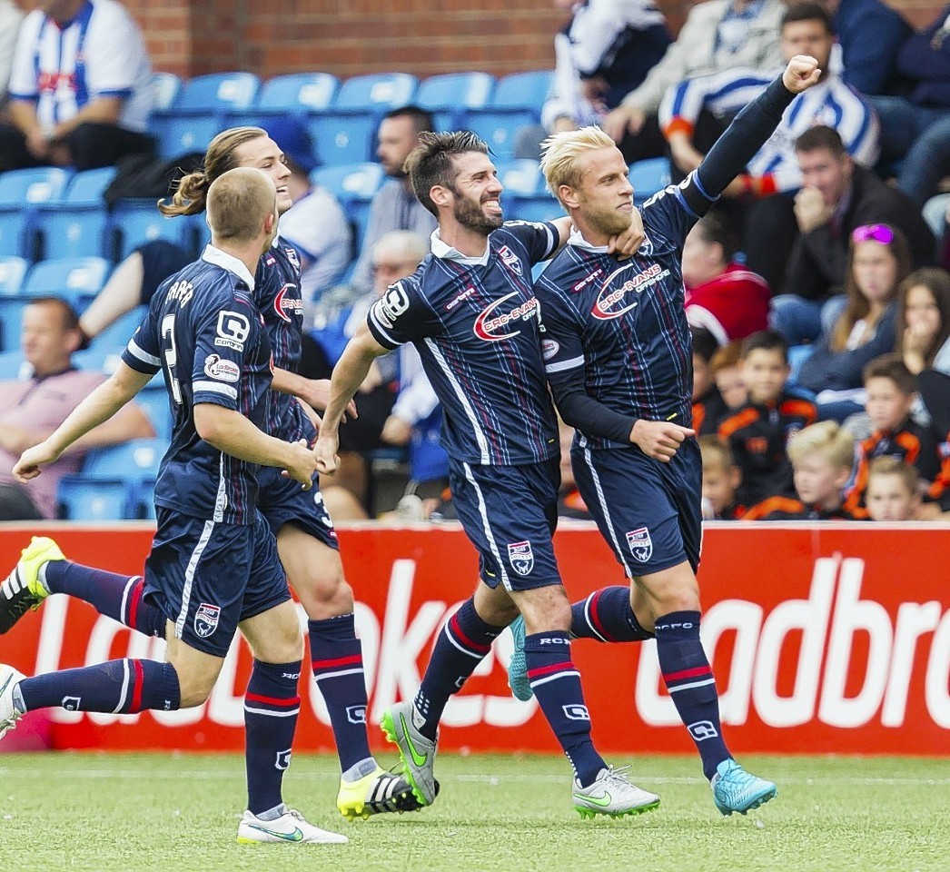 Andrew Davies (right) celebrates netting County's fourth goal with his team mates