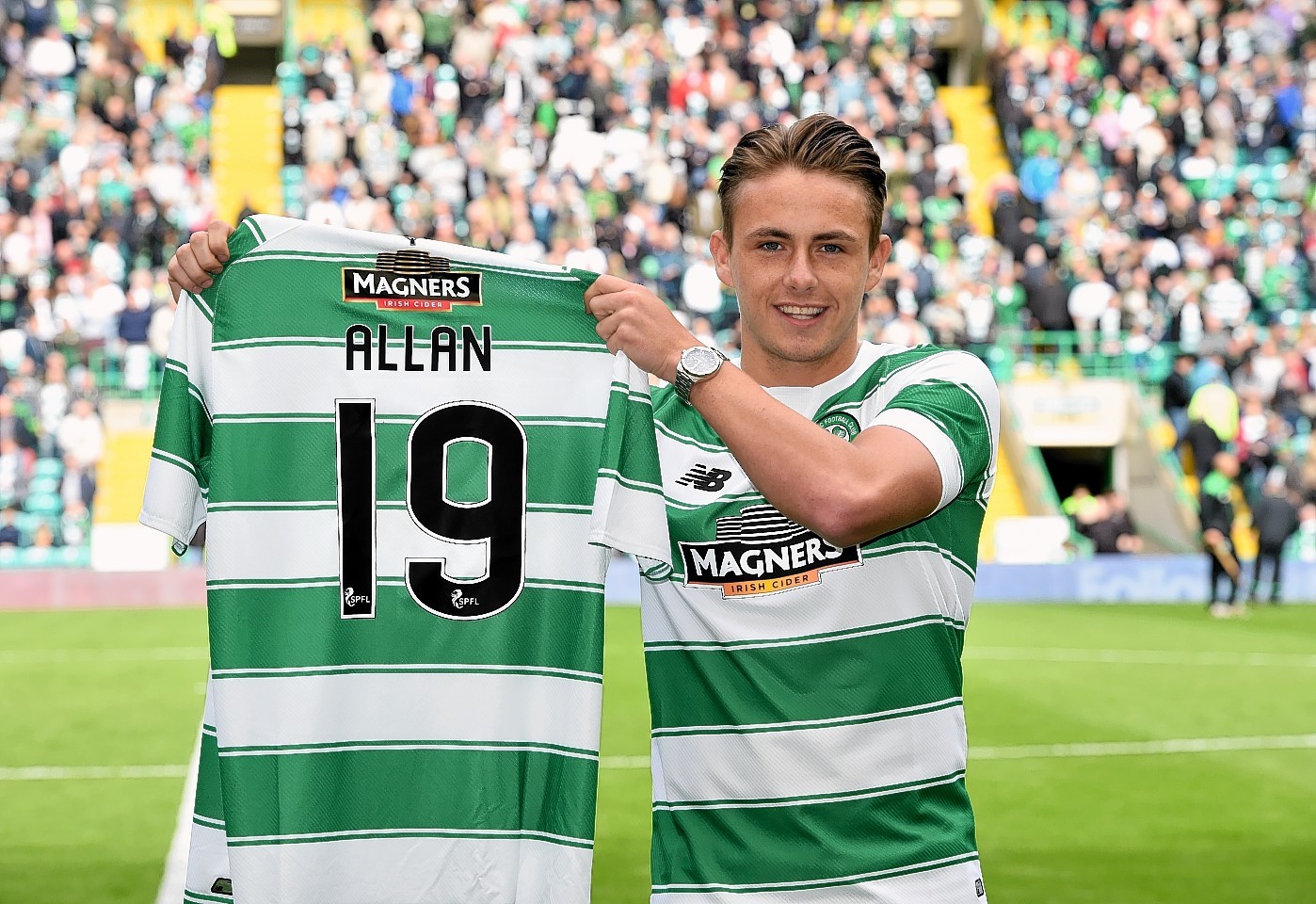 New Celtic signing Scott Allan is all smiles after being unveiled to the home support ahead of kick-off.